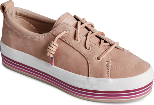 Low-top tan leather sneaker with a white and pink striped platform sole.