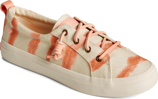 Low-top sneaker with light tan canvas and orange stripes with matching laces and white sole.