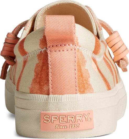 Rear view of a sneaker with peach and beige striped pattern, featuring laces, pull tab, and 'SPERRY Since 1935' logo on the sole.