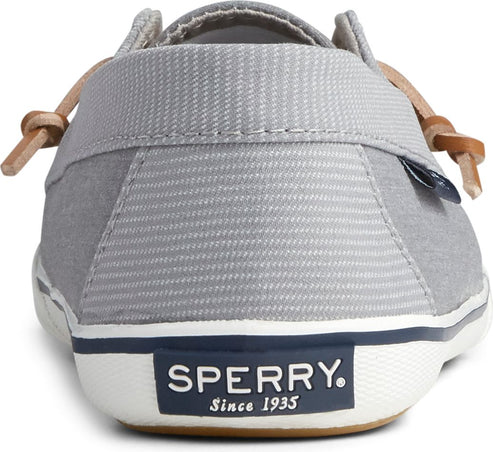 Gray slip-on shoe rear view; tag visible; laces tie at side; SPERRY Since 1935 text on heel.
