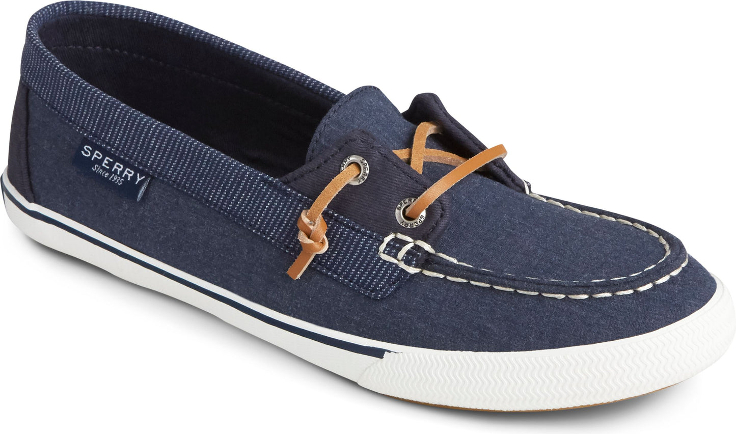 Blue canvas boat shoe with white sole and brown leather laces.