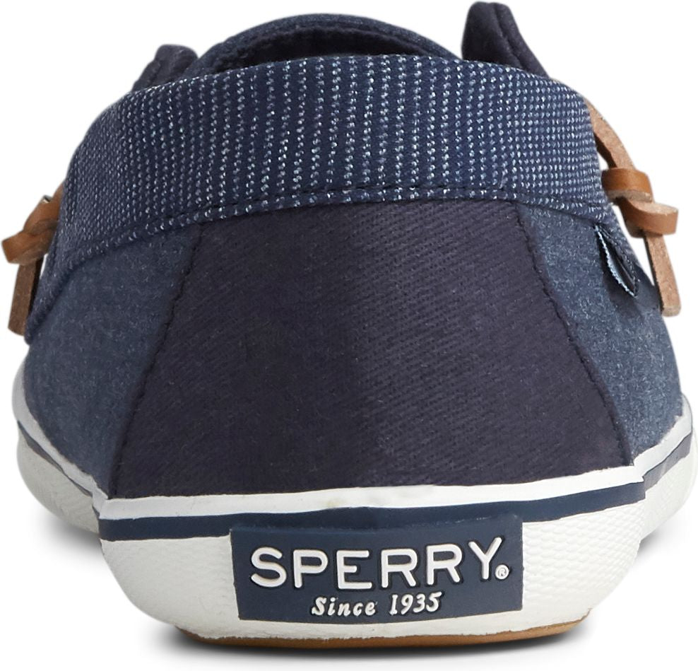Back view of a blue and white boat shoe with the text "SPERRY. Since 1935".