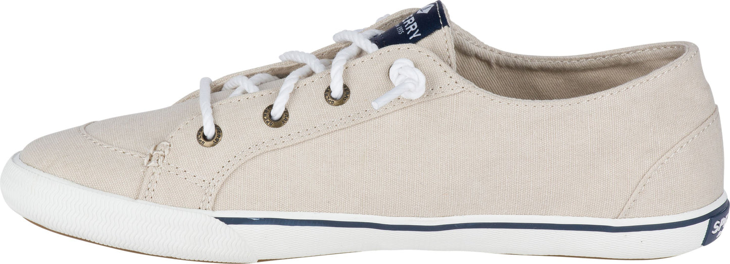 A tan-colored sneaker with white laces and a white sole.