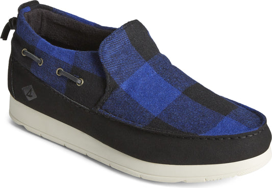 Slip-on shoe with a blue and black plaid pattern, black trim, and a white sole.