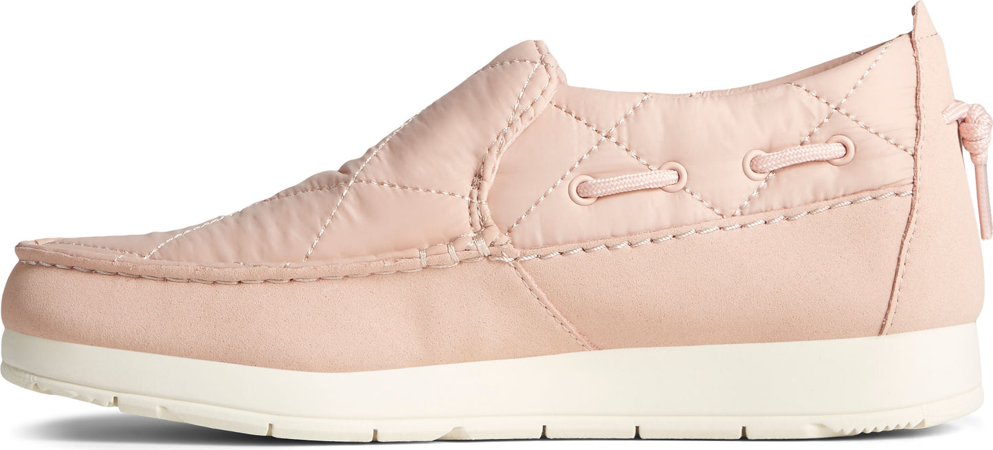 A pink, slip-on boat shoe with a white sole.