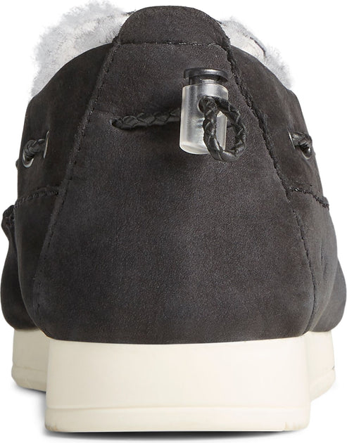 Back view of a black suede-like shoe with a toggle closure and a white sole.