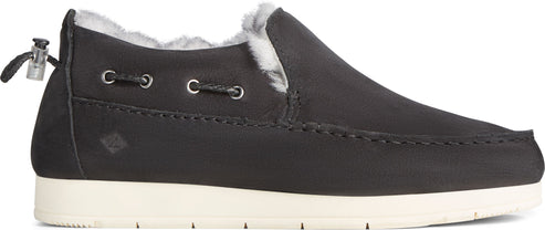 A slip-on shoe, in dark grey and with a white sole, lined inside with fur.