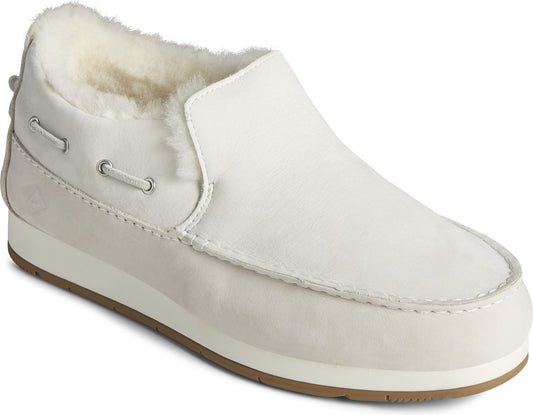 A white loafer style shoe with fur lining.