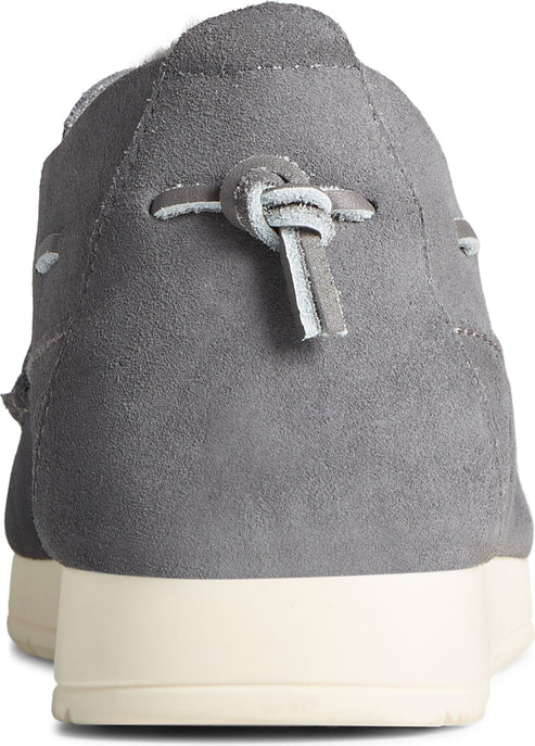 Gray suede shoe with knotted laces at the heel and a white sole.