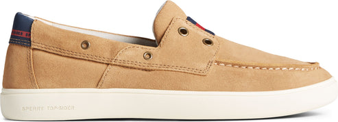 A tan-colored boat shoe with a white sole.