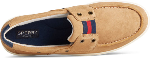 A tan boat shoe with a blue, red, and blue stripe across the top.