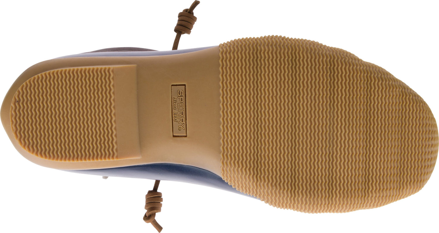 Bottom view of a brown sole with wavy ridges and the text "SPERRY" in the middle.