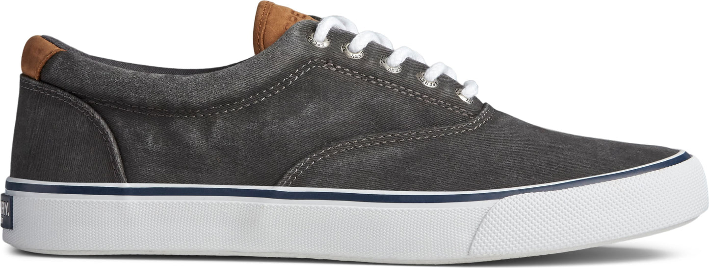 A gray canvas sneaker with white laces and a white sole.