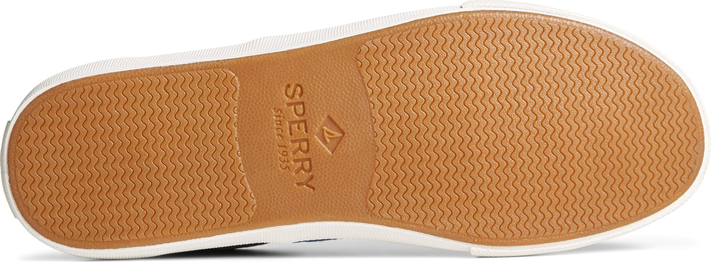The sole of a shoe featuring a Sperry logo and a wavy pattern.