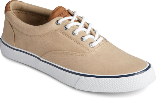 A tan canvas shoe with white laces, a brown tongue patch, and a white sole with a blue stripe.