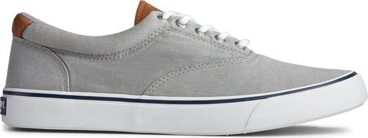 A grey canvas sneaker with a white sole and brown accents.