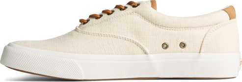Canvas sneaker in cream with brown laces and white soles.