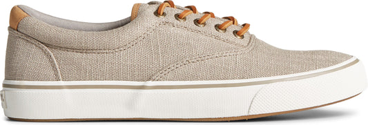 Beige canvas sneaker with leather laces and white sole.