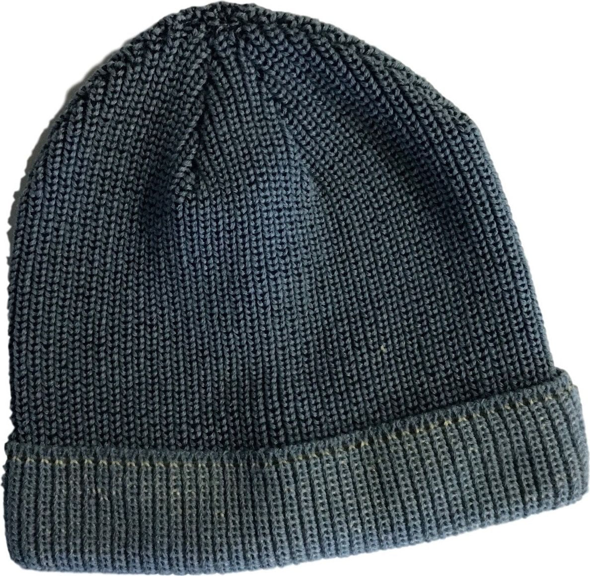 Close-up of a knitted beanie with a rolled brim.