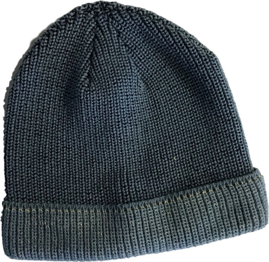 Close-up of a knitted beanie with a rolled brim.