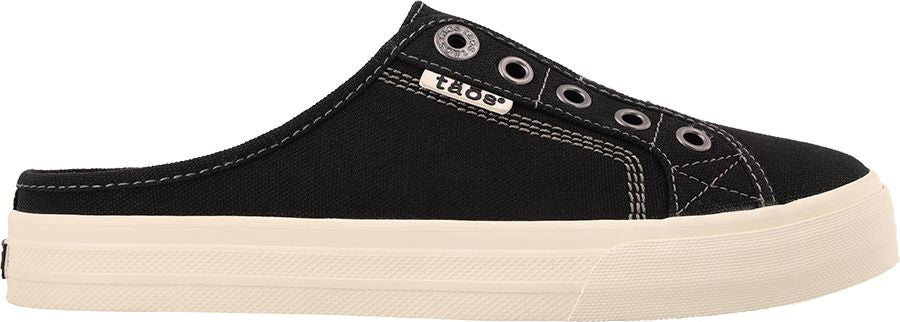 A black slip-on sneaker with a thick, cream-colored sole.
