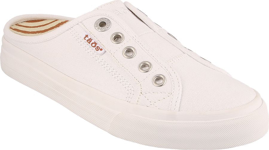 white canvas mule with decorative eyelets and TAOS logo on the side
