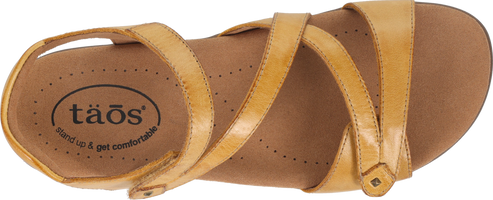 A tan sandal with multiple straps.