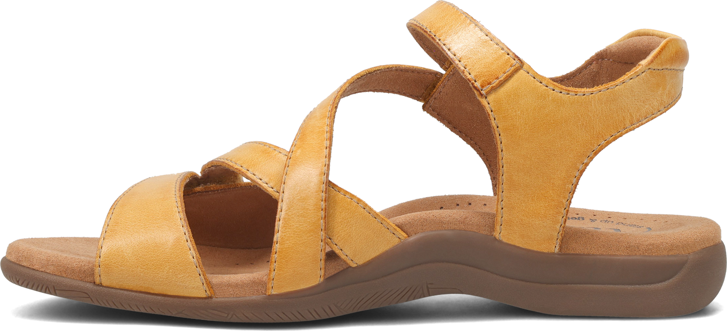 A sandal in tan leather with two straps crossing the foot.