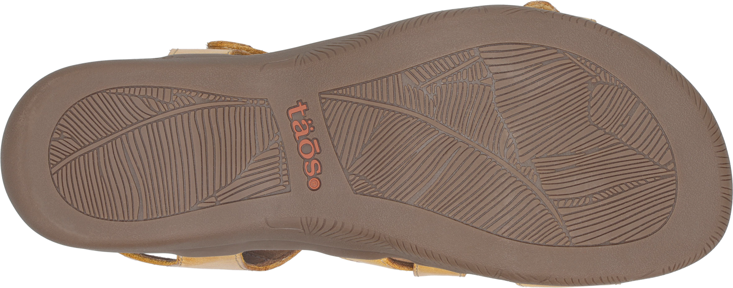 Sole of a sandal with leaf-like pattern and the text "taos".