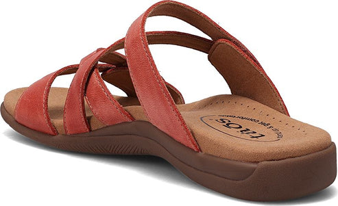 Red sandal with multiple straps and a brown sole.