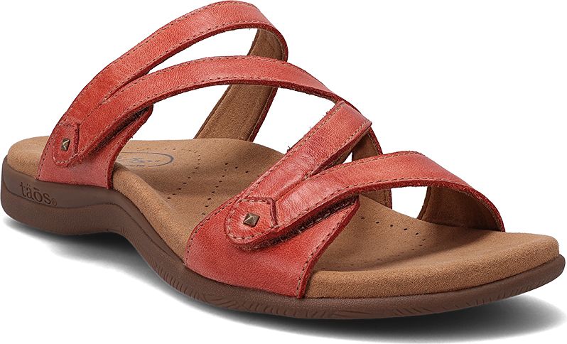 Red sandal with adjustable straps and a brown sole.