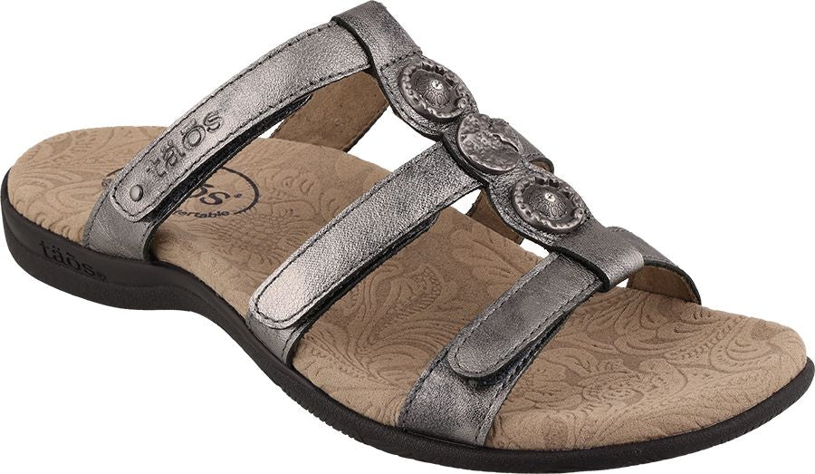Metallic silver sandal with adjustable straps and decorative circular accents.