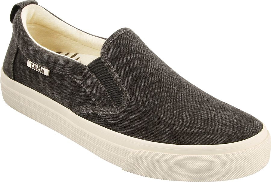 Slip-on sneaker with a dark gray canvas upper and a thick, textured, light-colored rubber sole.