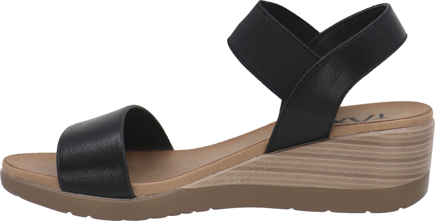 Black sandal with a wedge heel and elastic ankle strap.