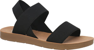 Black flat sandal with crisscross elastic straps.