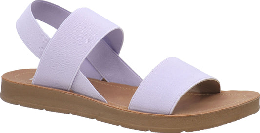 Lavender sandal with elastic straps and brown sole.