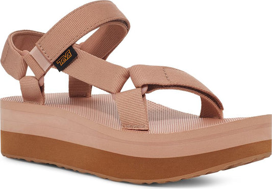 Tan platform sandal with adjustable velcro straps and black logo tag.