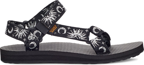 A sandal with black straps patterned with white sun and moon designs.