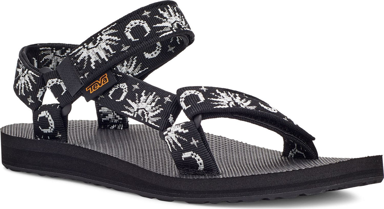 Black sandal with white sun and moon pattern straps.