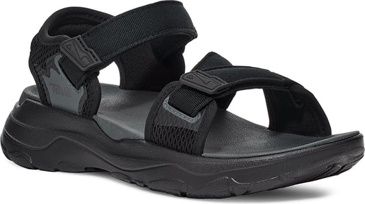 Black sandal with adjustable velcro straps and thick rubber soles.