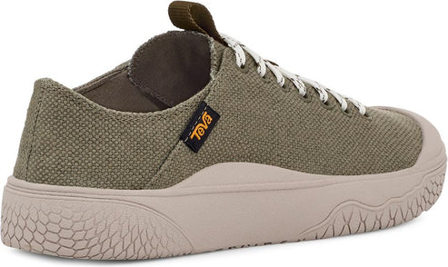 A low-profile olive green canvas shoe with off-white rubber sole and toe cap, white and black laces, and a brown Teva tag.