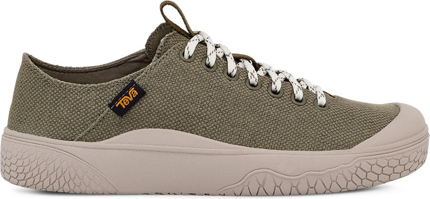 A canvas walking shoe in olive green with a beige sole and white laces.