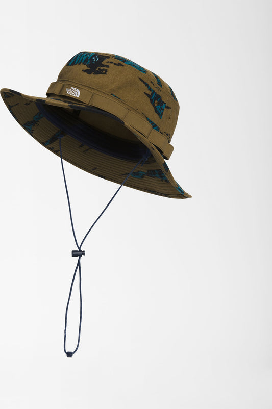 Olive-green patterned bucket hat with adjustable chin strap.
