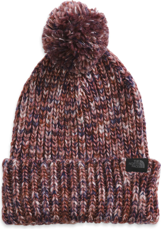 Beanie with pompom and a visible rectangle patch logo.