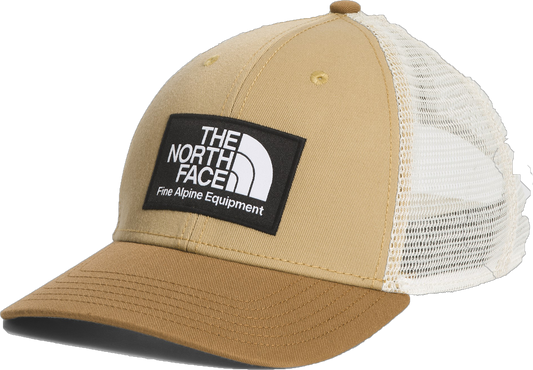 Tan trucker hat with brown brim, white mesh backing, and a rectangular patch with text "THE NORTH FACE Fine Alpine Equipment"