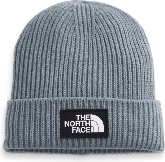 Gray knit beanie with a black and white logo patch.