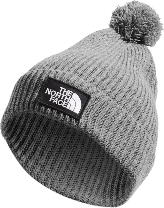 Gray knit beanie with pom-pom and a logo patch reading THE NORTH FACE.