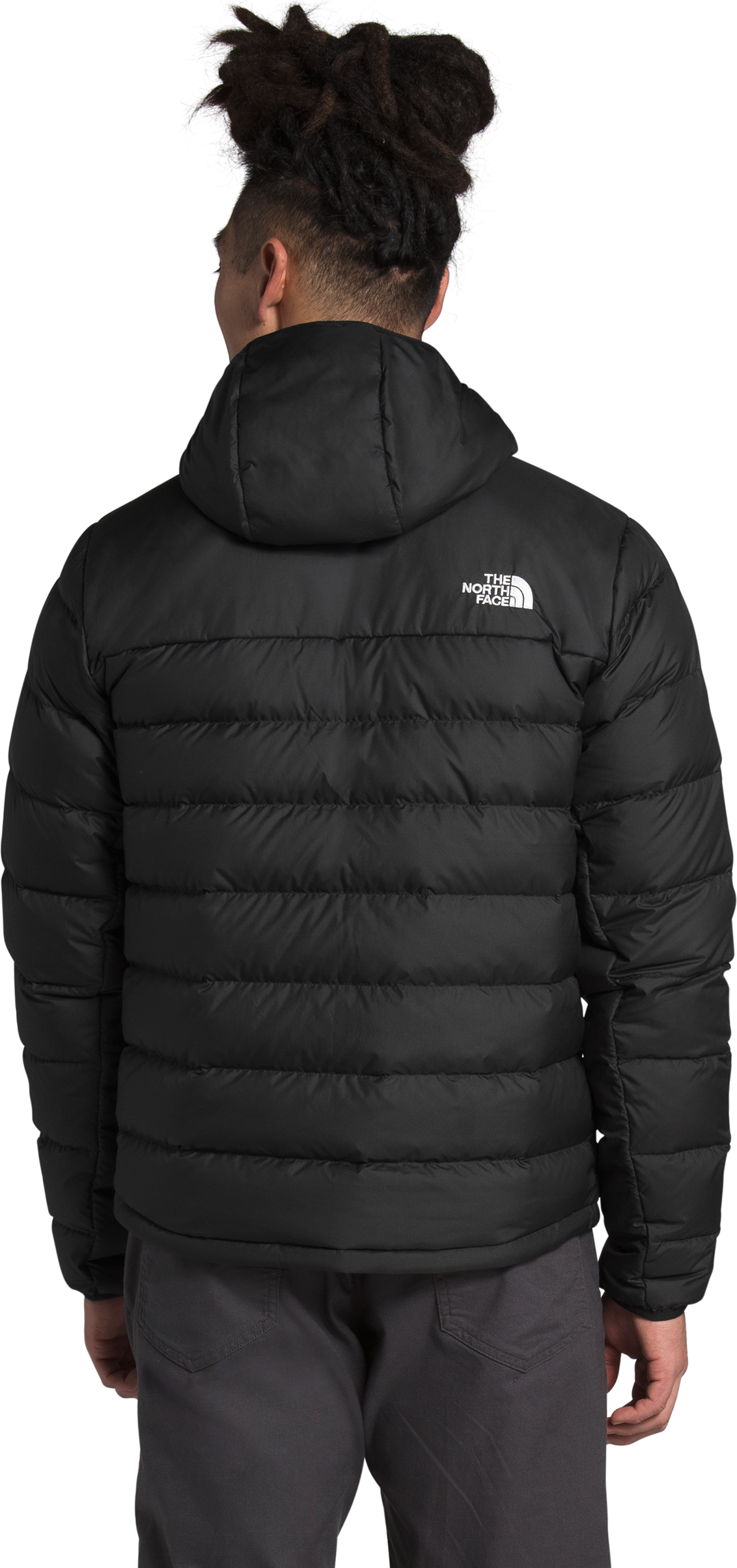 A black hooded puffer jacket with a white logo on the right shoulder.