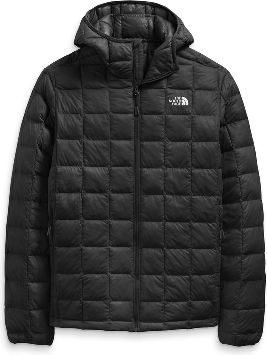 Black quilted hooded jacket with a zipper.