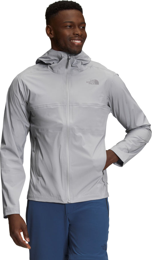 Man wearing a grey hooded jacket, front view.